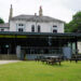 white stone building with black reception area in front of green grass, Hostels in York
